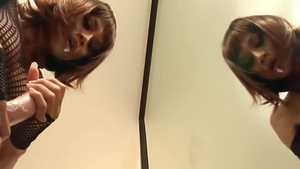 Redhead Ladyboy In darksome lingerie Sucks A sextoy By The Mirror